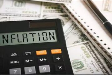 Picture of a calculator with the words inflation spelled on it